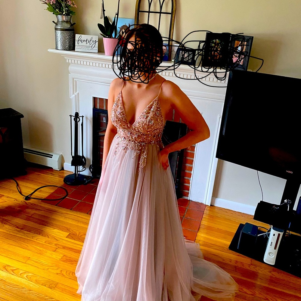 Prom dress never worn except for the picture. Smoke free home